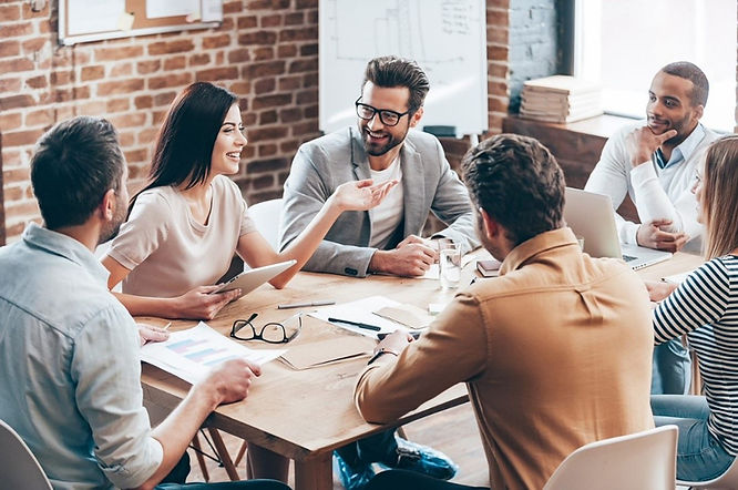Colleagues collaborating in a meeting room. 