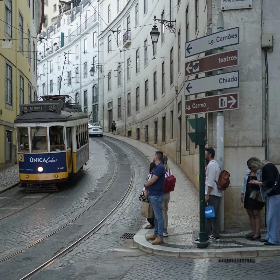 Lisbon trip from Travis of HTC Post-Wave, showing a curving road and trolly.
