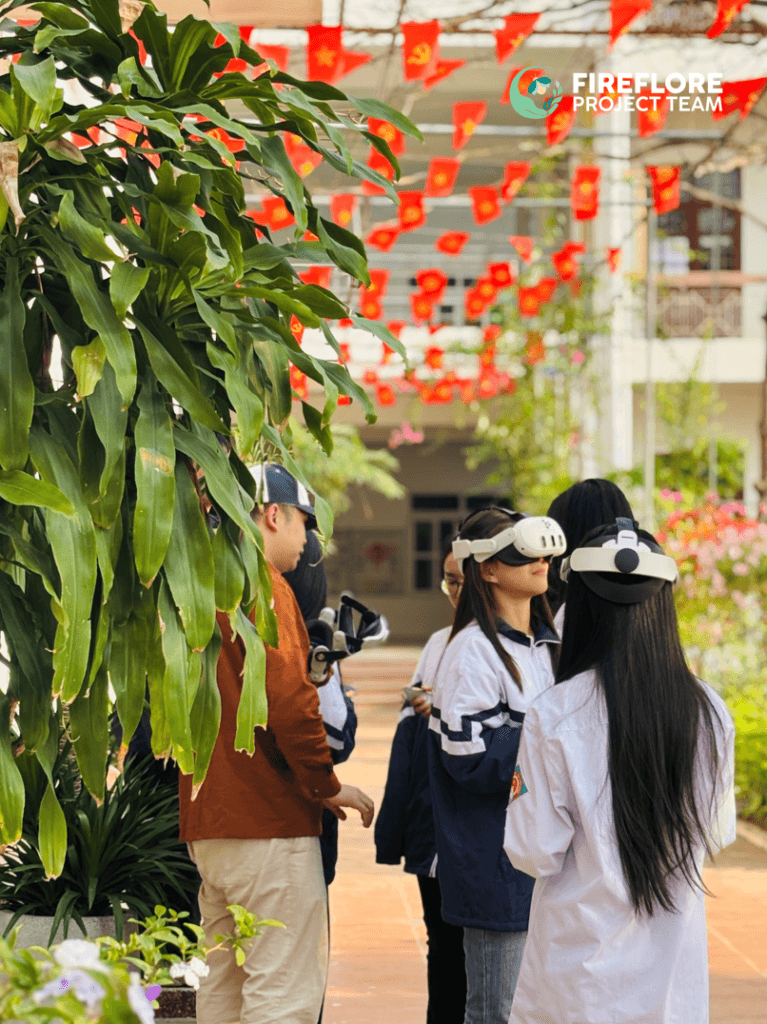 Students wearing VR headsets explore Firefly Memories in the courtyard of Yen Hung School in Quang Yen, Vietnam