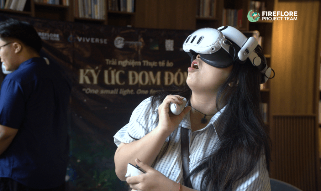 A participant wearing a VR headset experiences Firefly Memories at a conservation workshop in Ho Chi Minh City