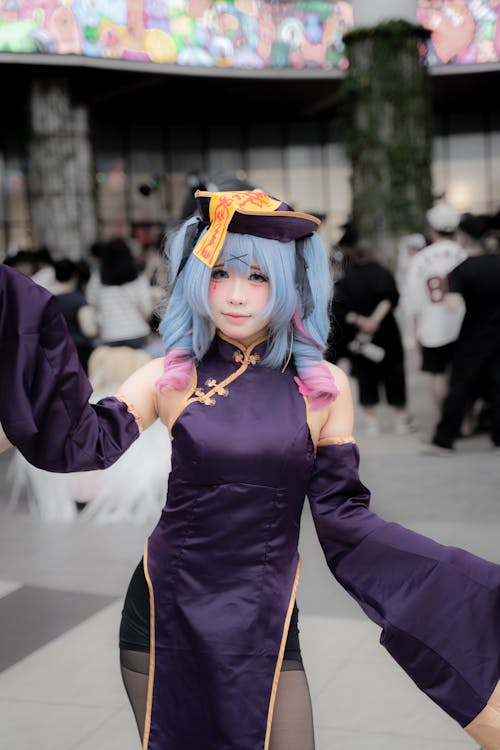 Cosplayer in a colorful anime-inspired costume at an outdoor fan event, representing Japanese idol and fandom culture