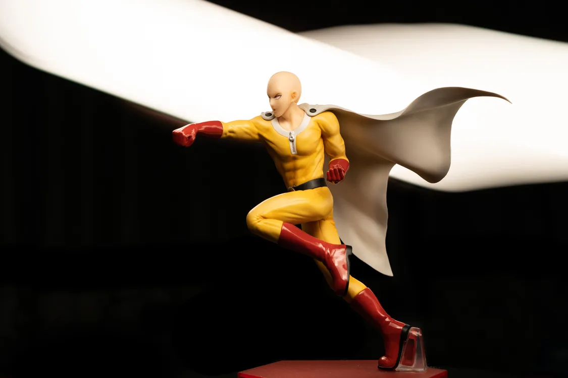 Dynamic superhero action figure in a striking pose, illustrating fictional-character collectibles and fan merch